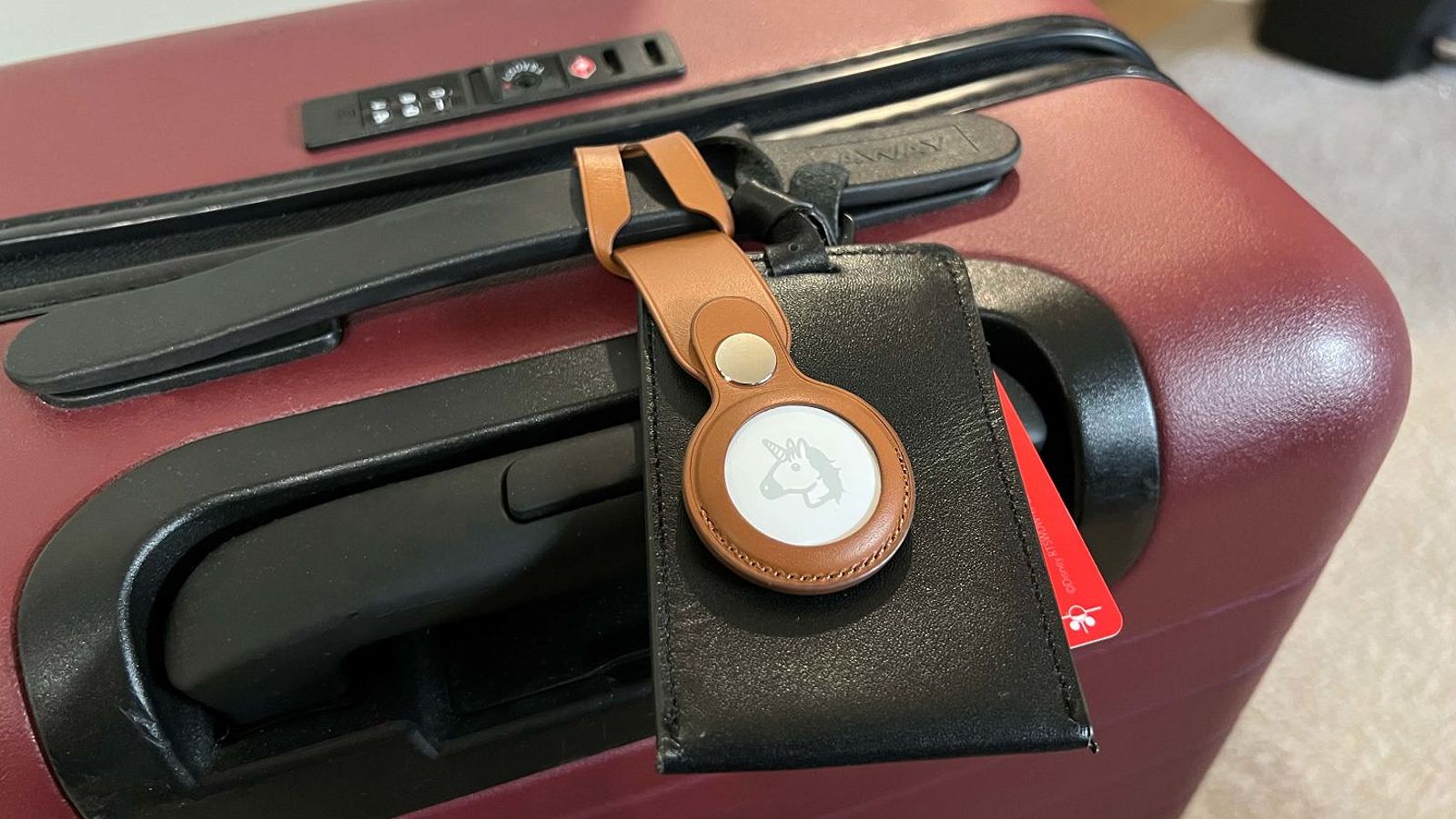 Apple AirTag attached to a suitcase