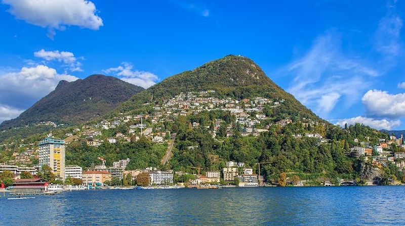 The picturesque view of Lugano, a lakeside city in Switzerland during fall